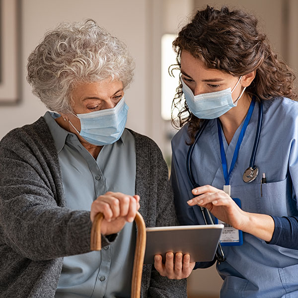Telemonitoring service in Vermont - image of elderly woman and nurse looking at a tablet
